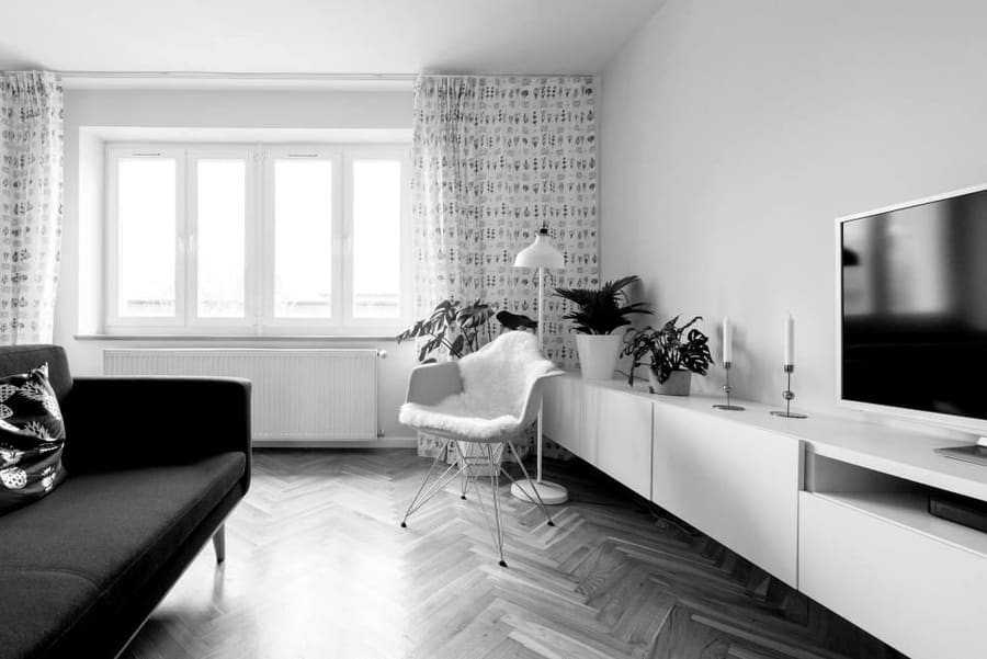 Bright living room with a flat-screen television